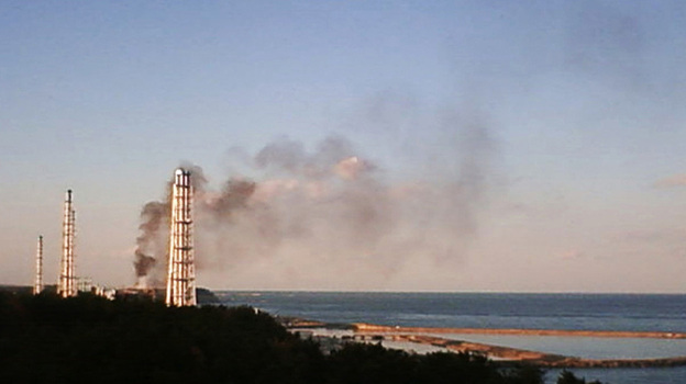 A live camera from Tokyo   Electric Power Co. shows black smoke billowing from the crippled  Fukushima  Dai-ichi nuclear power plant.  in northeastern  Japan on Wednesday.