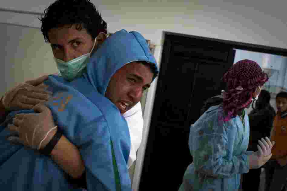 A Libyan man cries after identifying his brother at the morgue of the Jalaa hospital in Benghazi. His brother died during fighting around the city of Ajdabiya on Tuesday. 