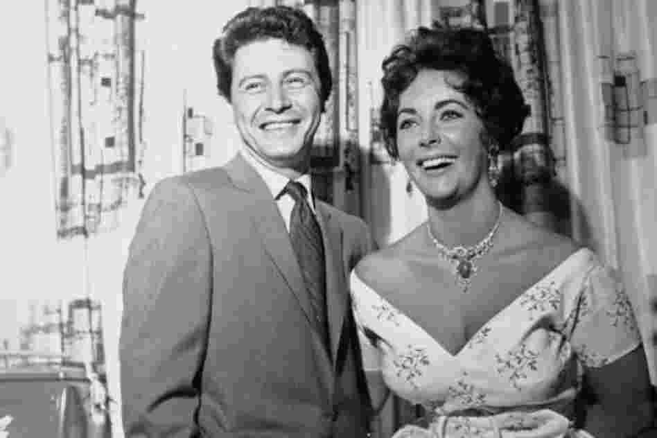 Taylor with her fourth husband, Eddie Fisher. Fisher divorced his wife, Debbie Reynolds, to marry Taylor, the widow of his best friend. 