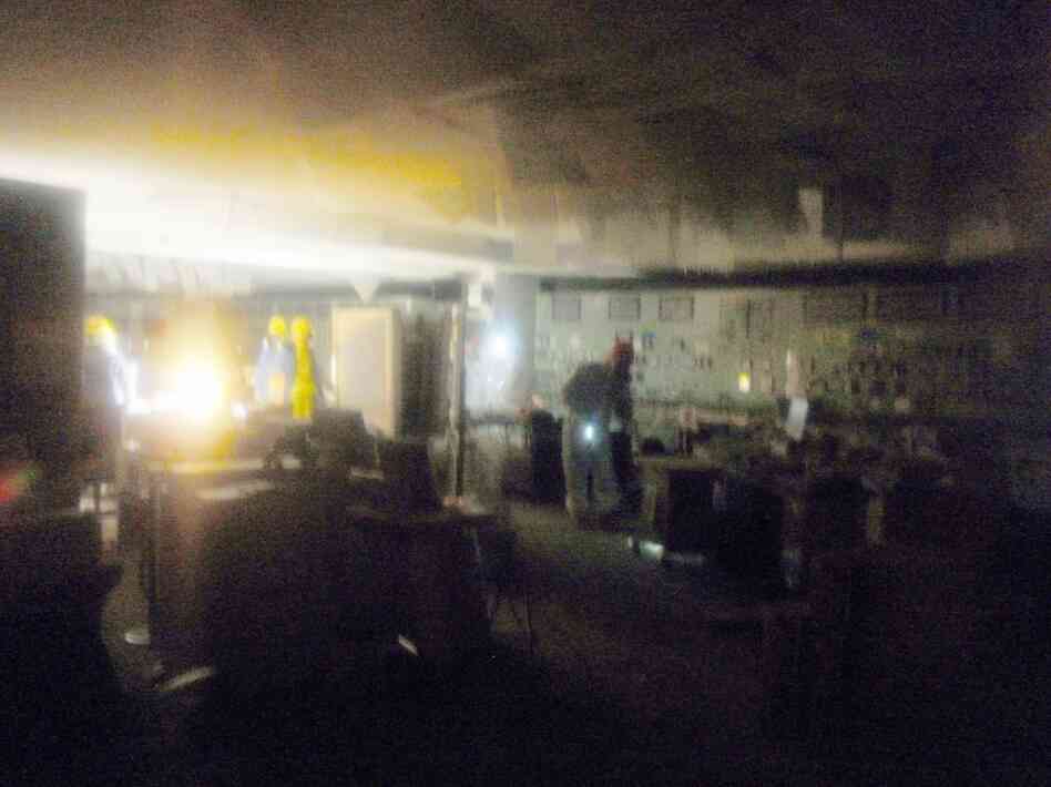 Workers collect data in the control room for Units 1 and 2. Workers collect data in the control room for Units 1 and 2.