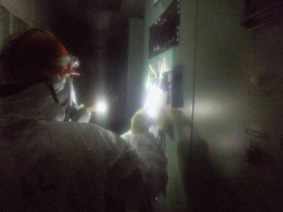 A Tokyo Electric Power Co. worker looks at gauges in the control room for Units 1 and 2 at the Fukushima Dai-ichi plant, Wednesday. A Tokyo Electric Power Co. worker looks at gauges in the control room for Units 1 and 2 at the Fukushima Dai-ichi plant, Wednesday.