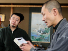 Japanese Buddhist monk Tanaka Tokuun, who was evacuated from Fukushima prefecture, looks over an instrument measuring radiation levels at a hotel on March 17. Japanese Buddhist monk Tanaka Tokuun, who was evacuated from Fukushima prefecture, looks over an instrument measuring radiation levels at a hotel on March 17.