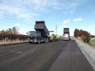 Road crews rebuild a highway damaged in the earthquake. Road crews rebuild a highway damaged in the earthquake.