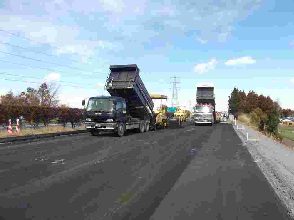 Road crews rebuild a highway damaged in the earthquake. Road crews rebuild a highway damaged in the earthquake.