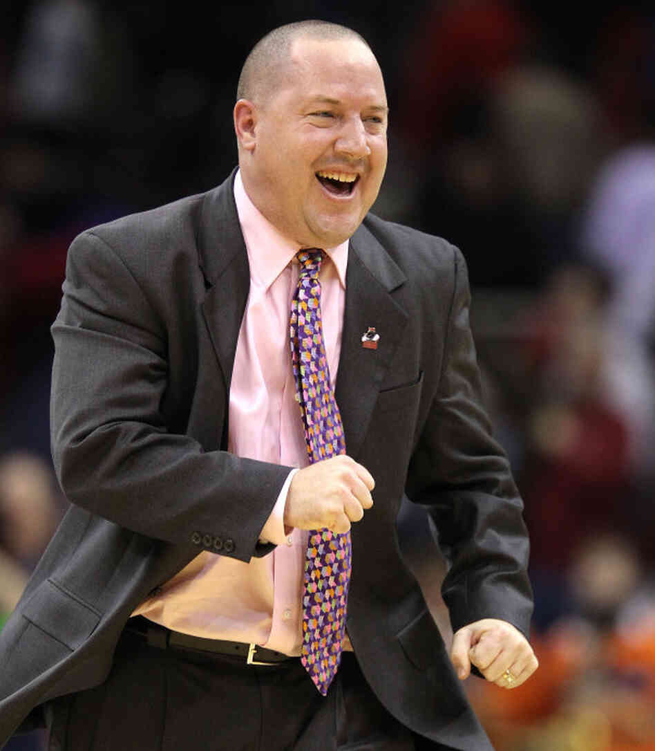 Coach Buzz Williams leads his Marquette Golden Eagles to an upset win over Syracuse in the third round of this year's NCAA basketball championships. Coach Buzz Williams leads his Marquette Golden Eagles to an upset win over Syracuse in the third round of this year's NCAA basketball championships.