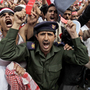 A Yemeni army officer, center, shouts slogans along with anti-government protesters during a demonstration demanding the resignation of President Ali Abdullah Saleh on Friday. Yemen's longtime ruler told tens of thousands of supporters that he's ready to leave power but he doesn't trust his opponents, whom he called "drug dealers." A Yemeni army officer, center, shouts slogans along with anti-government protesters during a demonstration demanding the resignation of President Ali Abdullah Saleh on Friday. Yemen's longtime ruler told tens of thousands of supporters that he's ready to leave power but he doesn't trust his opponents, whom he called "drug dealers."