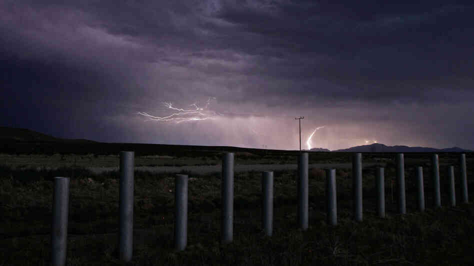 The U.S.-Mexico border is marked with steel vehicle barriers near Columbus, N.M. The quiet border town was rocked recently when its mayor, police chief, a city councilman and others were arrested on gun smuggling charges.