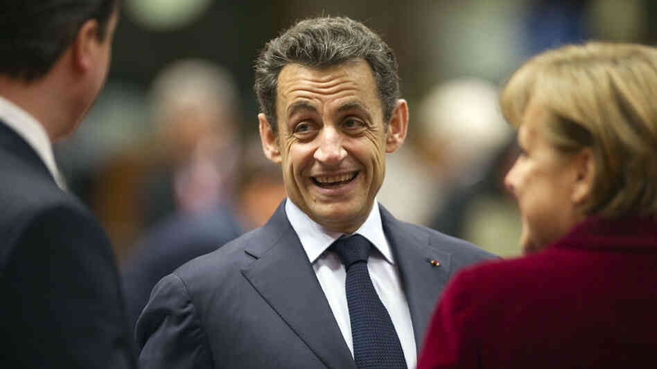 French President Nicolas Sarkozy talks with German Chancellor Angela Merkel and British Prime Minister David Cameron on Friday. French President Nicolas Sarkozy talks with German Chancellor Angela Merkel and British Prime Minister David Cameron on Friday.