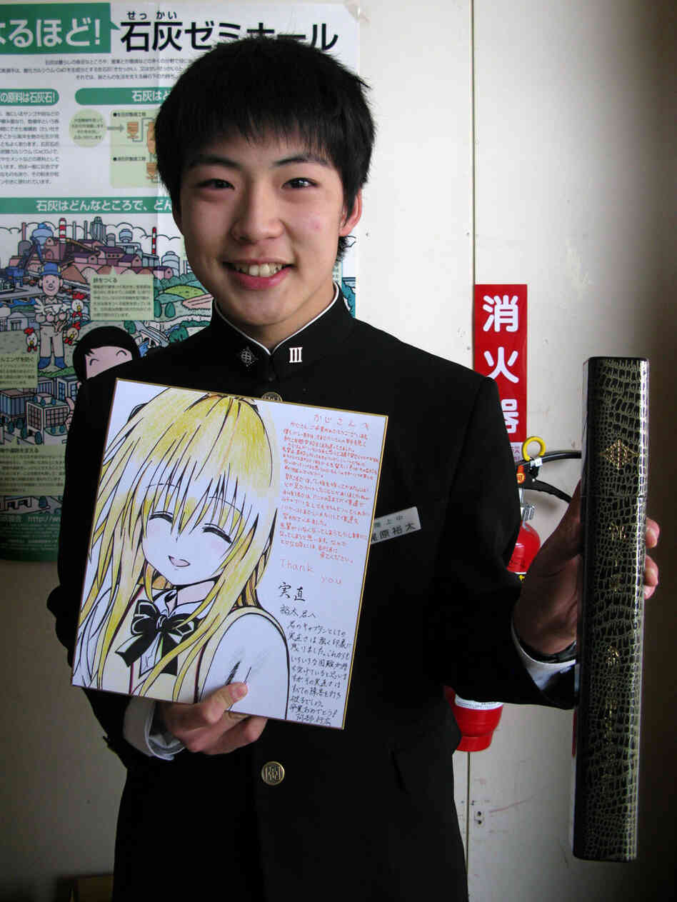 Yuta Kajiwara holds his junior high school diploma and a large graduation card given to him by members of his volleyball club. One of his classmates was killed in the tsunami and two remain missing. Kajiwara says he has known the victims since grade school. Yuta Kajiwara holds his junior high school diploma and a large graduation card given to him by members of his volleyball club. One of his classmates was killed in the tsunami and two remain missing. Kajiwara says he has known the victims since grade school.