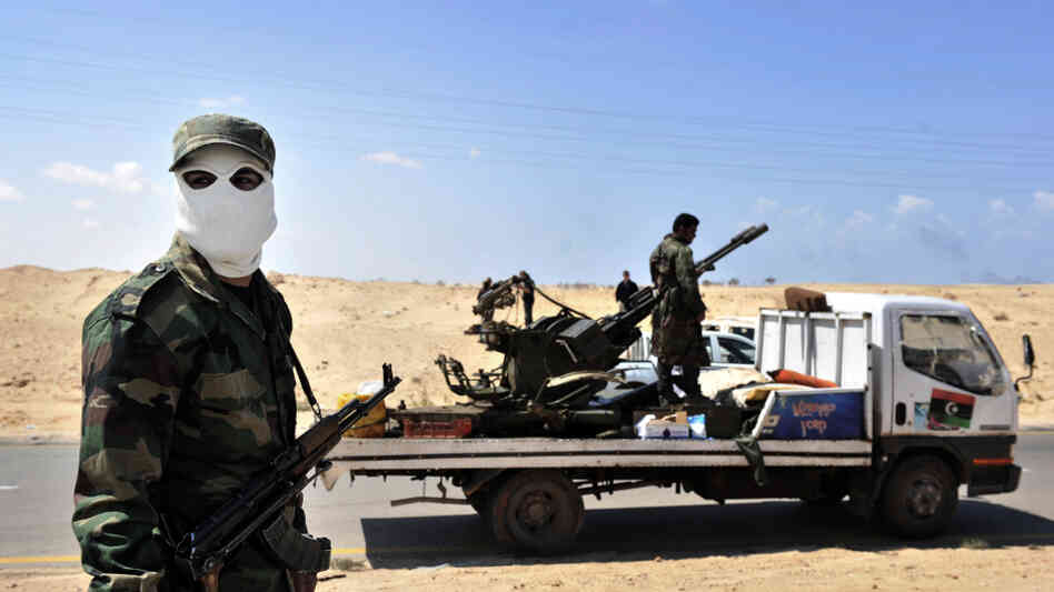 Libyan rebels prepare for battle against government forces outside the eastern gateway city of Ajdabiya.