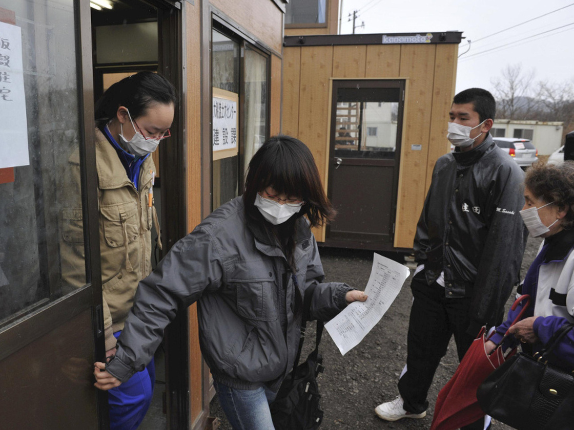 Evacuees who lost their homes in the March 11 earthquake and tsunami visit a makeshift city hall to apply for temporary housing in Rikuzentakata, Japan.