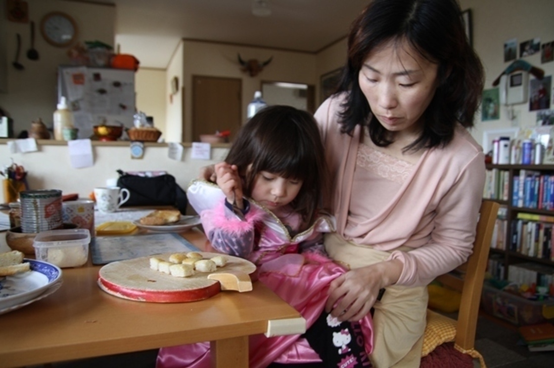 Junko Holland gets her daughter Sophie ready for school in the small town of Aizuwakamatsu. The family is trying to find some normalcy while living uncomfortably close to a quake-damaged nuclear plant.
