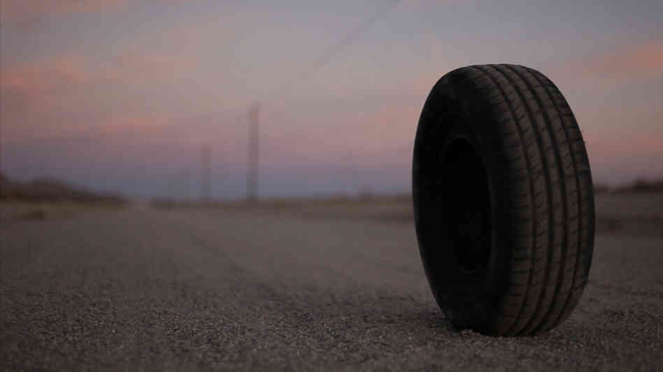 They See Me Rollin': "Robert" is a tire with telekinetic powers — and an increasingly unpleasant way of putting them to work — in Quentin Dupieux's consciously anarchic horror comedy Rubber. They See Me Rollin': "Robert" is a tire with telekinetic powers — and an increasingly unpleasant way of putting them to work — in Quentin Dupieux's consciously anarchic horror comedy Rubber.