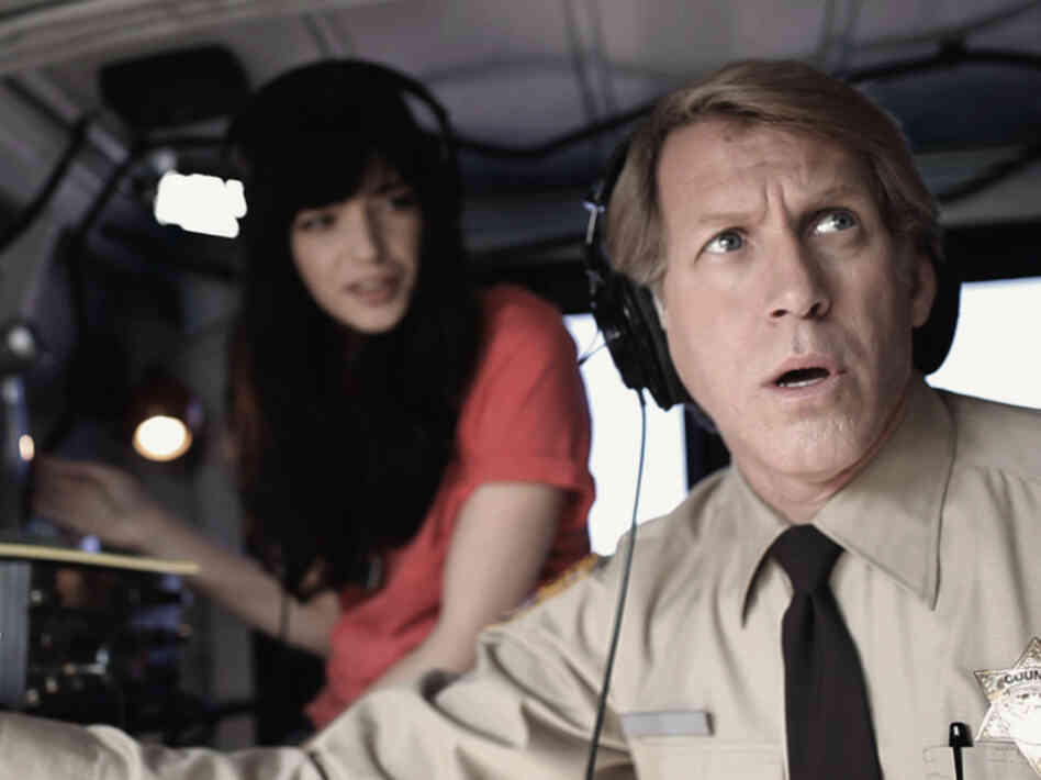 Sheila (Roxanne Mesquida) and Lieutenant Chad (Stephen Spinella) are tasked with destroying the tire.