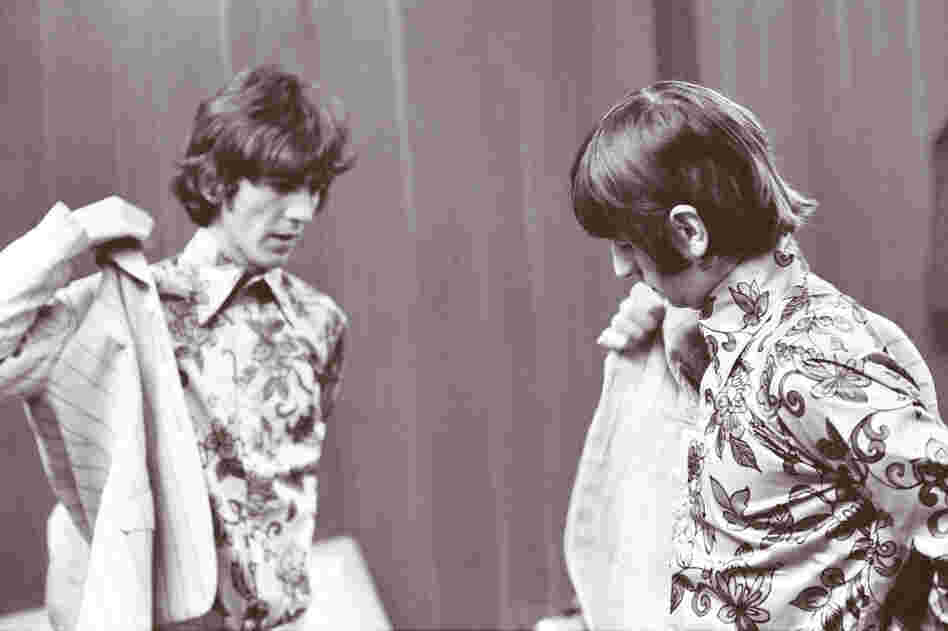 Harrison and Ringo Starr dress before going on stage in Detroit, on Aug. 13, 1966.