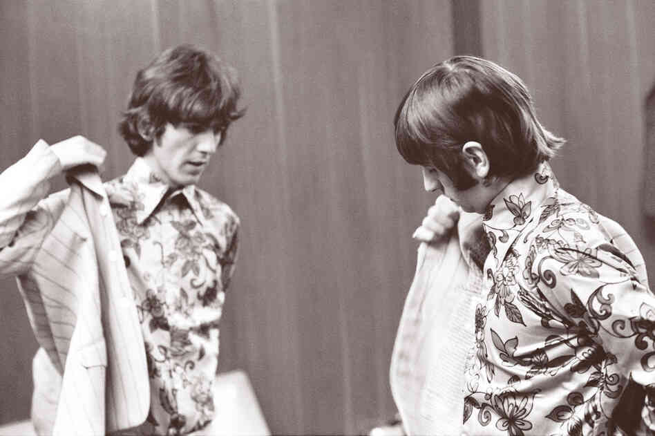 Harrison and Ringo Starr dress before going on stage in Detroit, on Aug. 13, 1966.