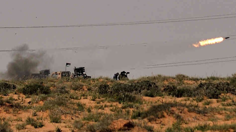 Rebels fired missiles at forces loyal to Libyan leader Moammar Gadhafi near the town of Bin Jawad.