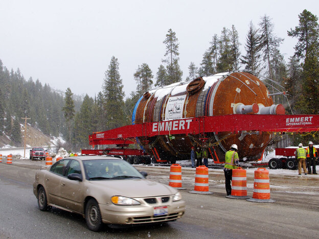 A coke drum waits along Montana's U.S. Highway 12 during a dry-run shipment in early March. The load can travel only late at night and is destined for a new oil refinery in Billings, Mont.