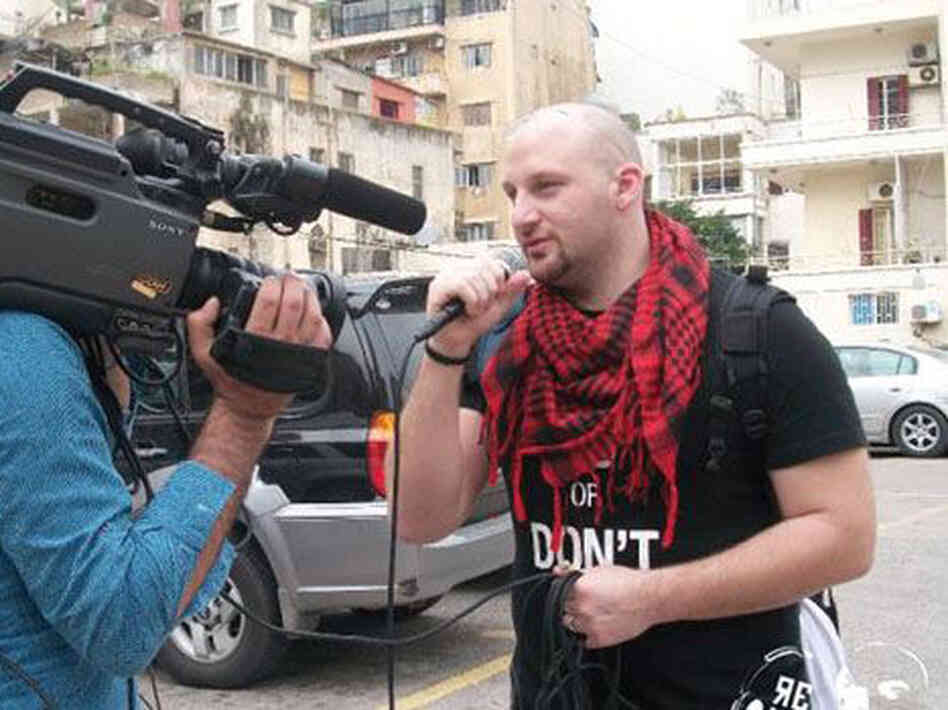 Hass Dennoui, founder of Re-Volt Radio, a platform promoting Arab hip-hop, films a spot along a street in Jeddah, Saudi Arabia. Hass Dennoui, founder of Re-Volt Radio, a platform promoting Arab hip-hop, films a spot along a street in Jeddah, Saudi Arabia.