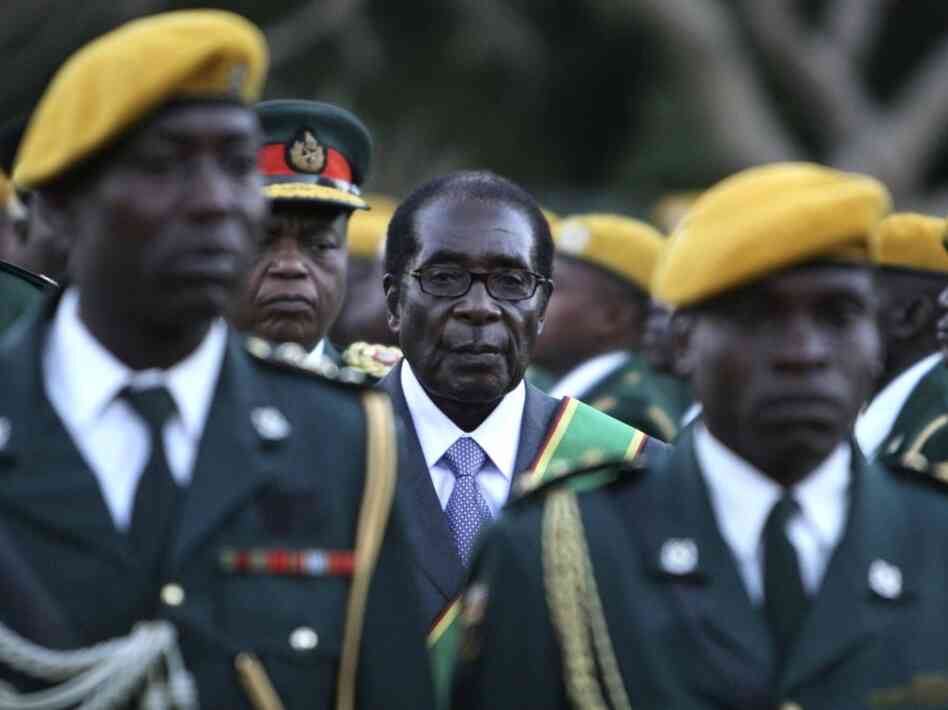 Zimbabwean President Robert Mugabe stands at his 2008 inauguration ceremony at the statehouse in Harare.