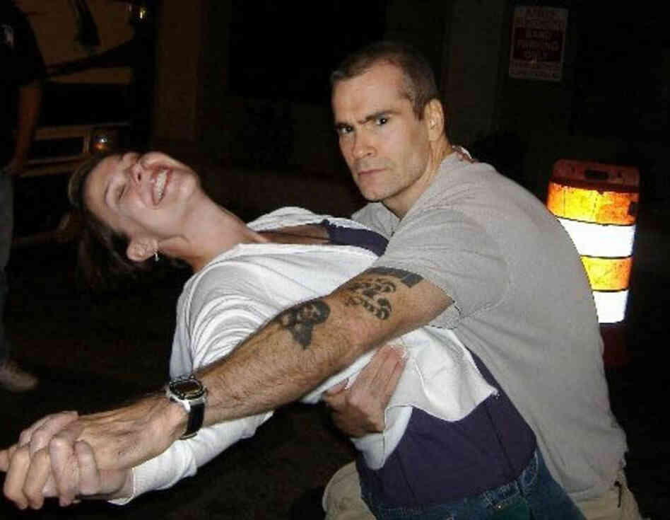 "Henry Rollins has to be the kindest, most considerate celebrity in existence. He meets and speaks with every fan who waits for him outside his tour bus after every show. This was my third time meeting him, after a show in Charlotte, N.C., on Sept. 28, 2007, and I already had two photos where we just stood there smiling. This time, I suggested he dip me. 'Like, ballroom dancing? YES. Let's do t...