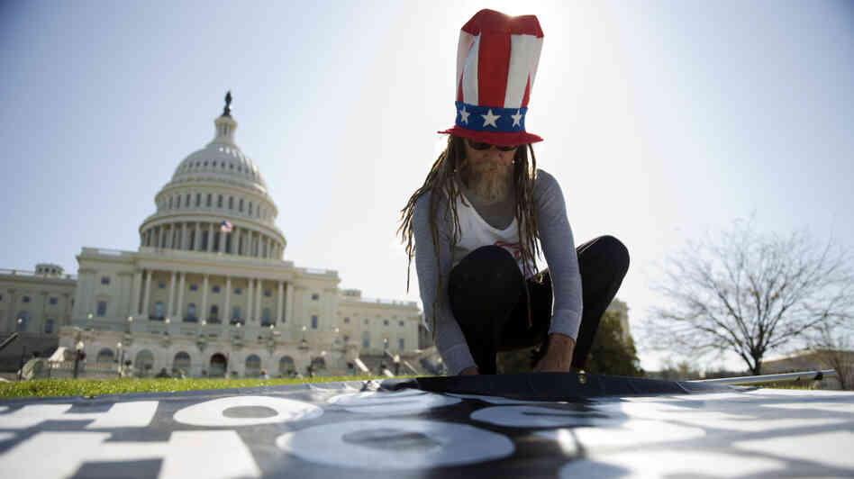 David Wilson of Florida, with the Stop Infant Circumcision Society, works on a readies a sign for a protest in Washington last March.