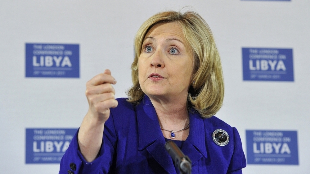 Secretary of State Hillary  Clinton speaks during a news conference after a meeting on Libya in  London  Tuesday. World powers agreed that Moammar  Gadhafi should step down after 42 years as Libya's ruler but did not  discuss arming the rebels who seek to oust him.
