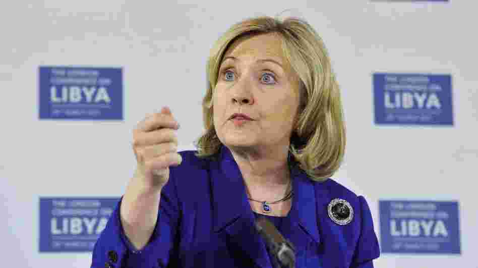Secretary of State Hillary  Clinton speaks during a news conference after a meeting on Libya in  London  Tuesday. World powers agreed that Moammar  Gadhafi should step down after 42 years as Libya's ruler but did not  discuss arming the rebels who seek to oust him.
