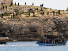 North African refugees arrive at Lampedusa, Italy on March 30, 2011.