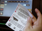 If only he'd chipped in: A Mega Millions ticket. If only he'd chipped in: A Mega Millions ticket.