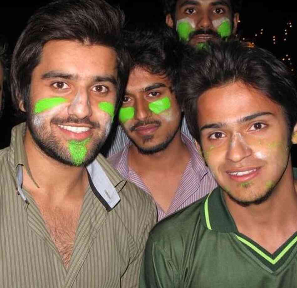 Arsalan Ghazi, front left, and Danish Ilyas, front right, showing their colors and hoping that despite Pakistan's loss the match will be a step toward better relations with India. Arsalan Ghazi, front left, and Danish Ilyas, front right, showing their colors and hoping that despite Pakistan's loss the match will be a step toward better relations with India.
