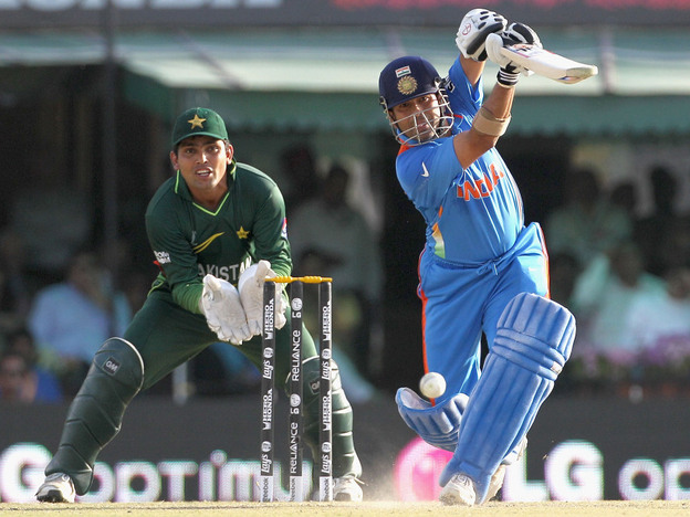 Sachin Tendulkar of India, right, bats as Kamran Akmal of Pakistan looks on earlier today (March 30, 2011).