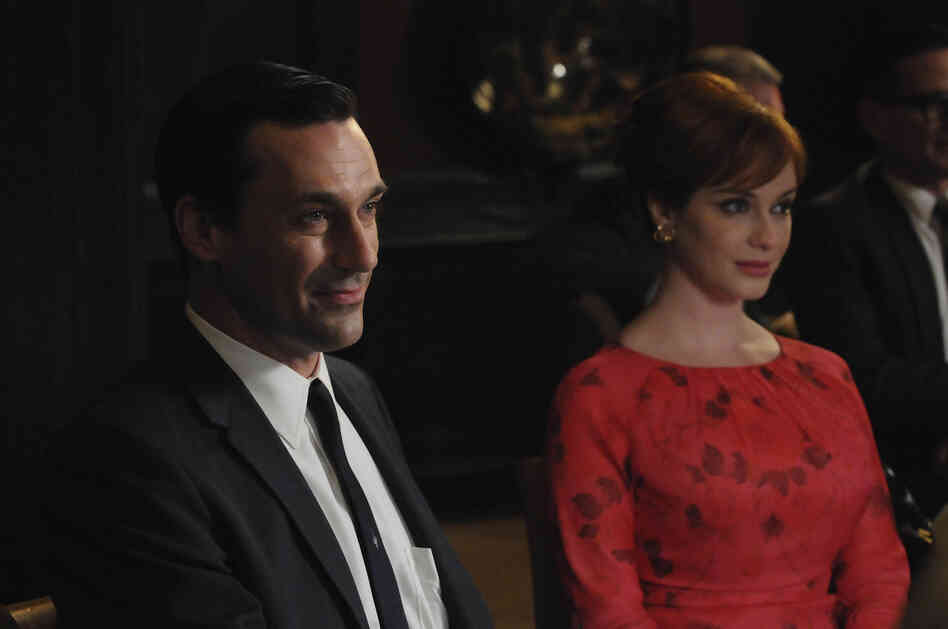 Jon Hamm as Don Draper, Christina Hendricks as Joan Harris