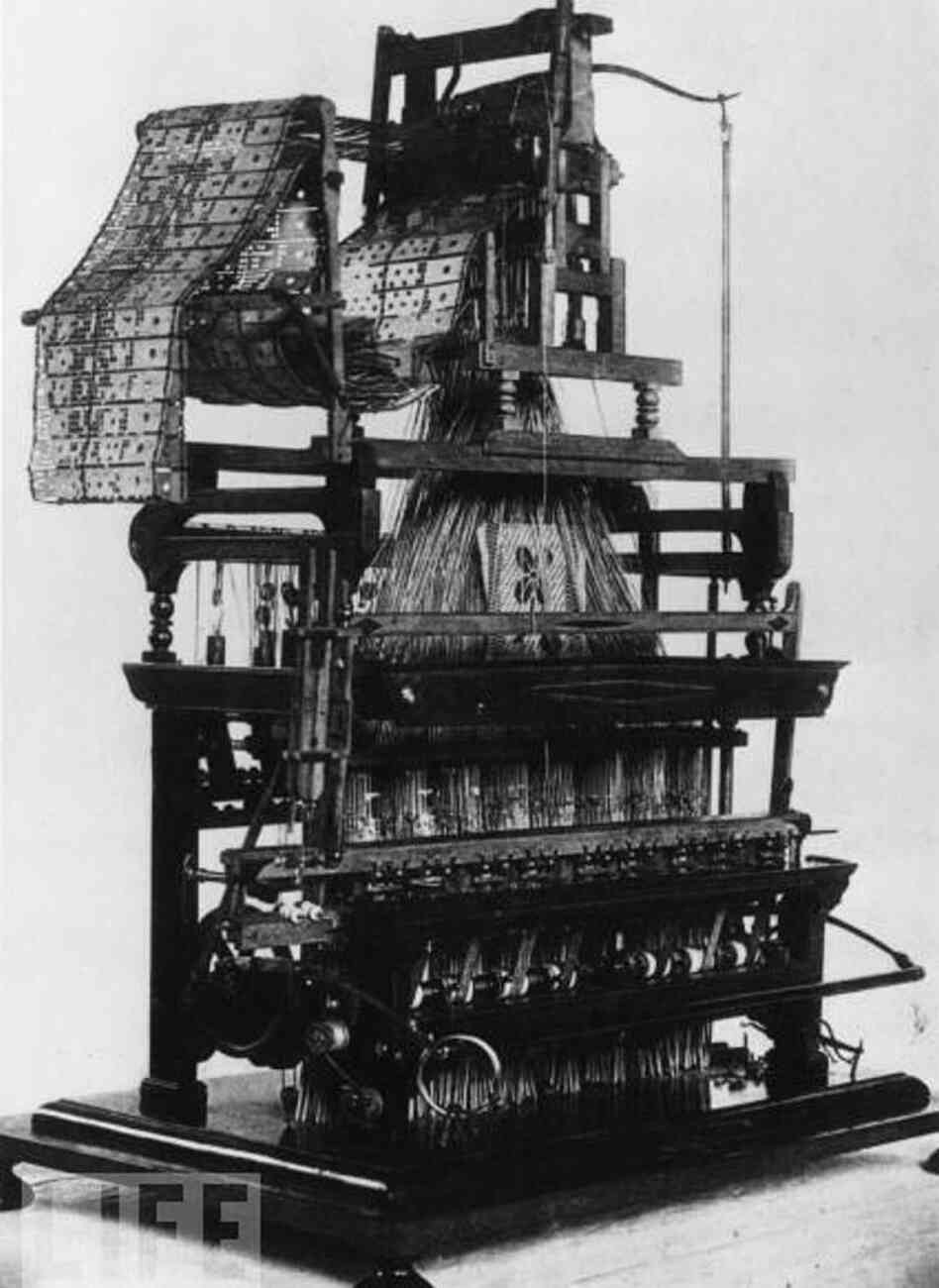 This weaving loom, designed by Joseph Marie Jacquard in 1801, was the first machine to use punched cards to control a series of sequences — a key step in the development of computer programming. This weaving loom, designed by Joseph Marie Jacquard in 1801, was the first machine to use punched cards to control a series of sequences — a key step in the development of computer programming.