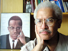 In his career, Manning Marable wrote about the struggle for equal rights — and especially the life of Malcolm X. In this file photo from 2001, he posed at his Columbia University office in New York. In his career, Manning Marable wrote about the struggle for equal rights — and especially the life of Malcolm X. In this file photo from 2001, he posed at his Columbia University office in New York.
