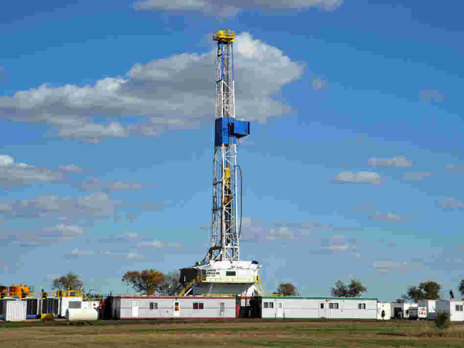An oil drilling rig is seen near Ray, N.D., last September. The well is being drilled into the Bakken Formation, one of the largest contiguous deposits of oil and natural gas in the United States.