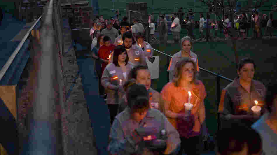 Community members, friends and family participate in a vigil held for the victims of the Upper Big Branch mine in front of the Whitesville Elementary School on April 7, 2010.