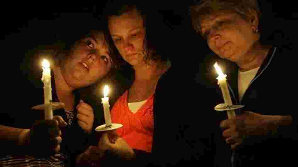 Relatives of Dean Jones, one of the 29 miners killed in the April 5 explosion of the Upper Big Branch mine, gathered for a vigil on April 10 with other families of the blast victims. From left are Julie Jones, Cassie Jones and Susan England.