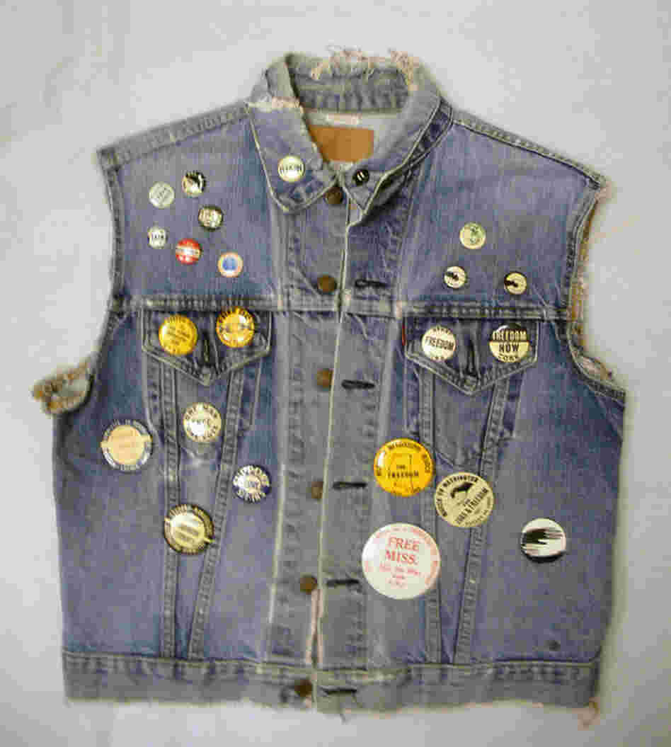 Denim Vest With SNCC ButtonsMulholland joined SNCC in 1960 and served as an office assistant in Mississippi for several years. A button that reads "Never" on the collar of her vest is Bunch's favorite. "That was what segregationists would wear to counter that, to say that you never integrate," Bunch explains. "But what the SNCC people did is they took that button and turned it upside dow...