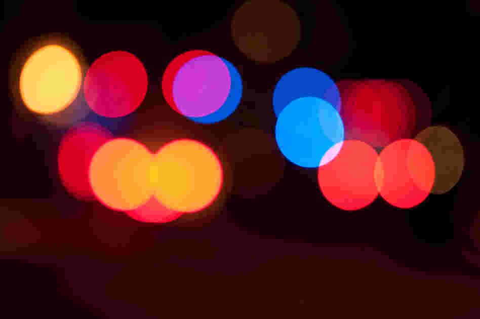 Blurred police and ambulance sirens at night. Blurred police and ambulance sirens at night.