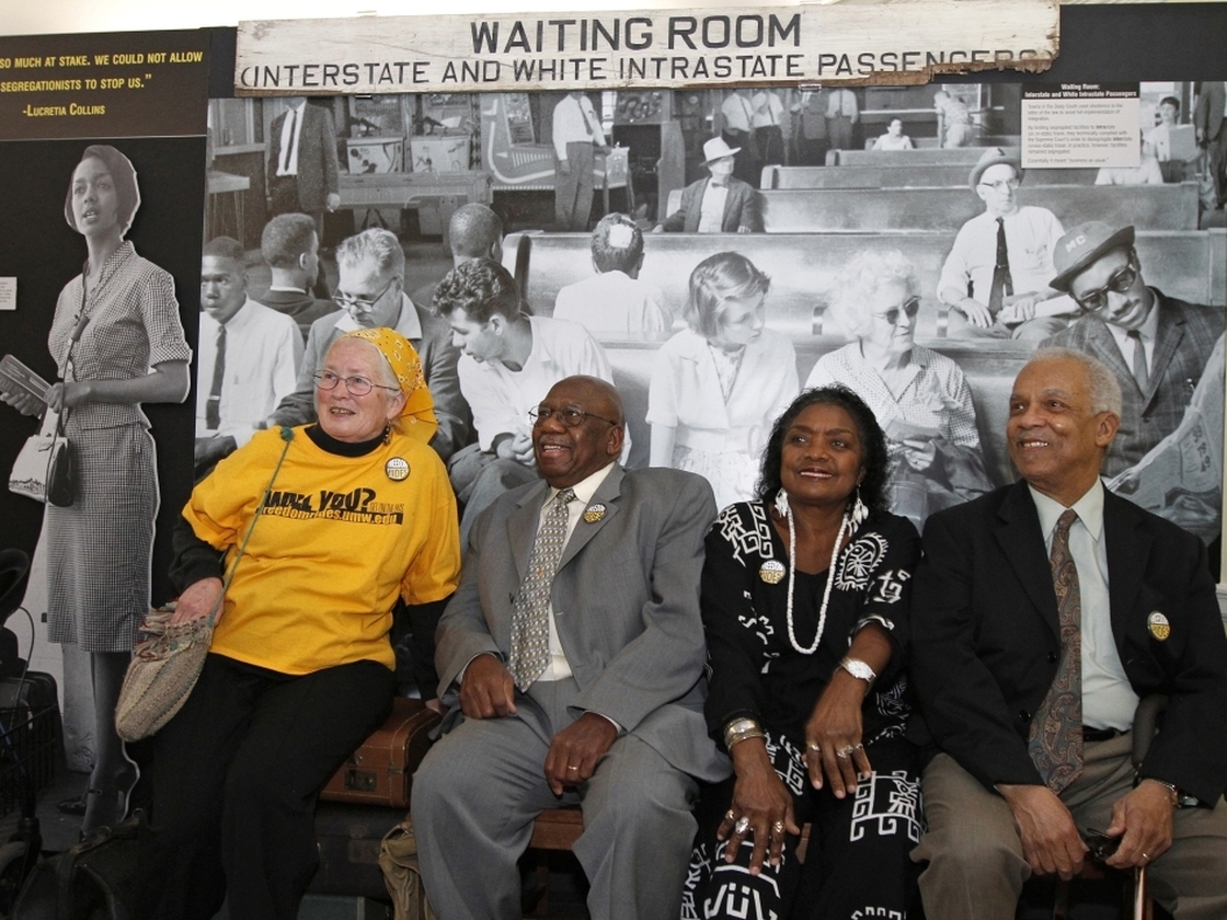 From left to right, Freedom Riders Joan Mulholland, Charles Person, Catherine Burks-Brooks and Reginald Green pose in front of a student-created exhibit on display at the University of Mary Washington in Fredericksburg, Va.