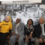 From left to right, Freedom Riders Joan Mulholland, Charles Person, Catherine Burks-Brooks and Reginald Green pose in front of a student-created exhibit on display at the University of Mary Washington in Fredericksburg, Va.