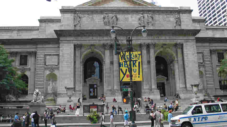 Pedestrians walk past the main building of the New York Public Library. But will they be going in to check out books in the future? Pedestrians walk past the main building of the New York Public Library. But will they be going in to check out books in the future?