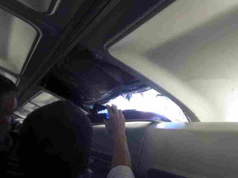 In this photo provided by passenger Brenda Reese, an unidentified passenger takes photos with a cell phone of a hole in the cabin on a Southwest Airlines aircraft. In this photo provided by passenger Brenda Reese, an unidentified passenger takes photos with a cell phone of a hole in the cabin on a Southwest Airlines aircraft.