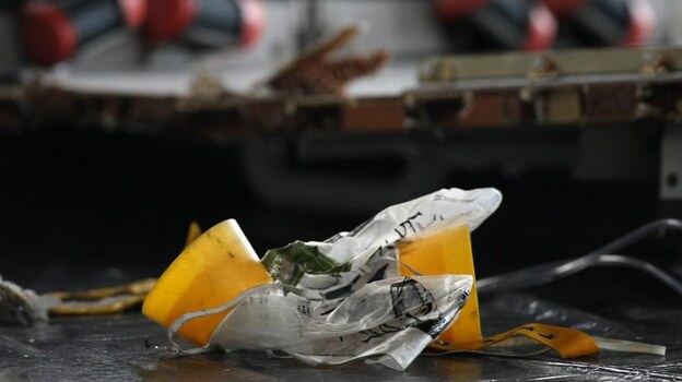 June 12, 2009 file photo: Some of the debris discovered shortly after the crash included this oxygen mask.