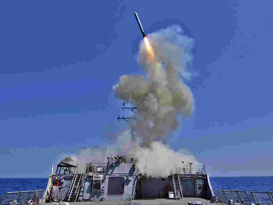The Arleigh Burke-class guided-missile destroyer USS Barry launches a Tomahawk cruise missile from the ships bow, off the Libyan coast on March 29. The Arleigh Burke-class guided-missile destroyer USS Barry launches a Tomahawk cruise missile from the ships bow, off the Libyan coast on March 29.