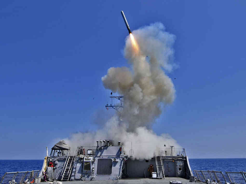 The Arleigh Burke-class guided-missile destroyer USS Barry launches a Tomahawk cruise missile from the ships bow, off the Libyan coast on March 29. The Arleigh Burke-class guided-missile destroyer USS Barry launches a Tomahawk cruise missile from the ships bow, off the Libyan coast on March 29.