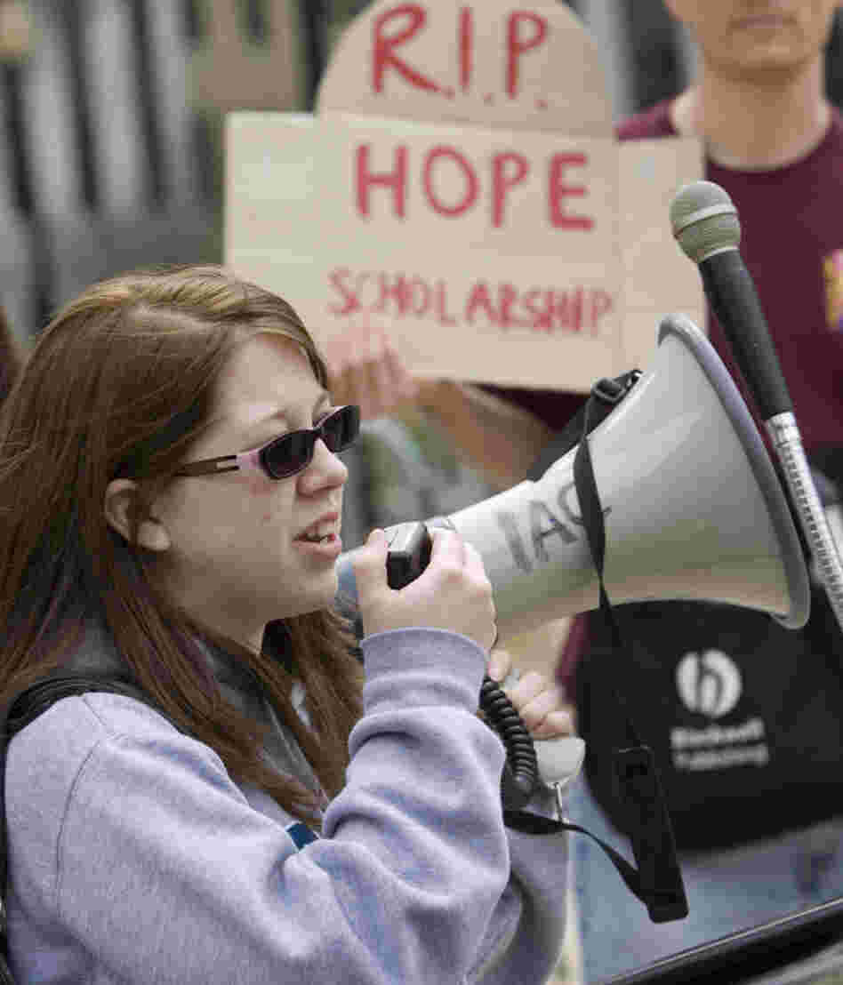 Georgia State University student Heather Sparks tells a crowd how she benefited from the HOPE scholarship during a March 8 demonstration outside the Georgia state capitol.
