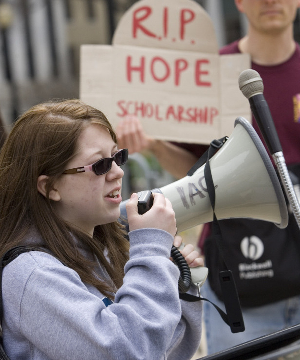 Georgia State University student Heather Sparks tells a crowd how she benefited from the HOPE scholarship during a March 8 demonstration outside the Georgia state capitol.