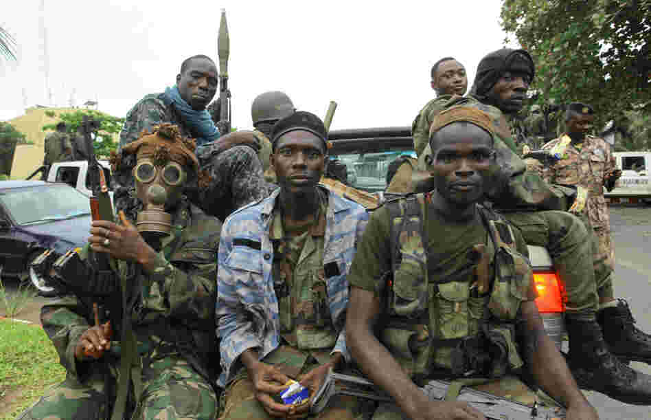 Fighters loyal to Ivory Coast President-elect Alassane Ouattara prepared for an assault in the city of Abidjan on Tuesday.